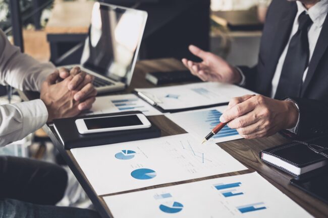 Co working conference, Business team meeting present, investor colleagues discussing new plan financial graph data on office table with laptop and digital tablet, Finance, accounting, investment