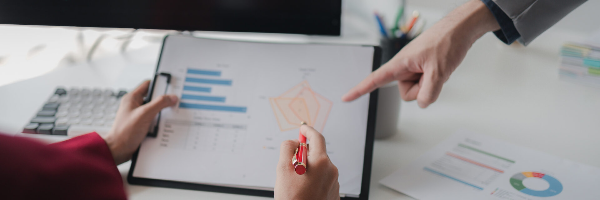 Two investors look at stock insights to analyze risk, stock investing businessman analyzing stock market rise and fall chart, stock market investor, profit making. investment concept.